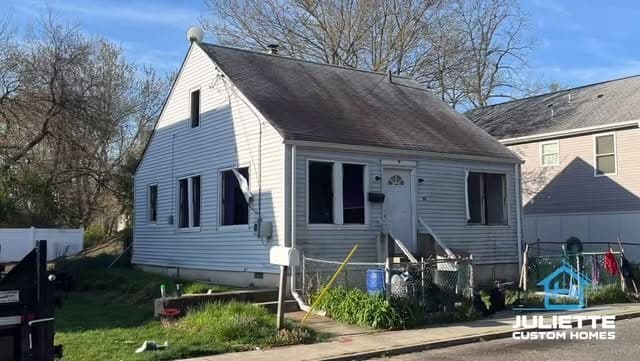 A one-story home before work began.