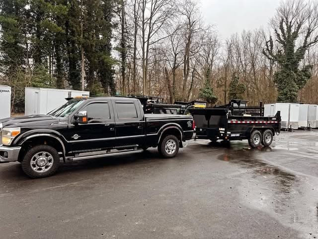 The company truck and dump trailer.